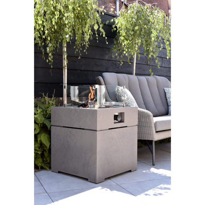 Cosibrixx 60 Concrete Effect Square Gas Fire Pit Table with lit fire and glass screen on an outdoor garden patio