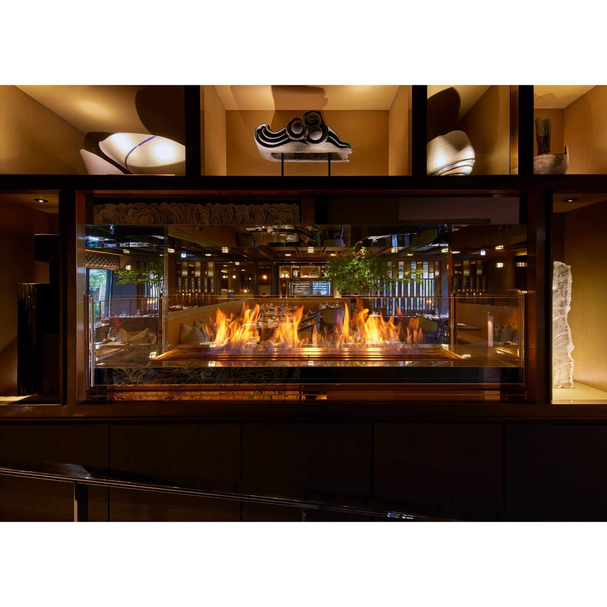 Fireplace with flames in a restaurant setting