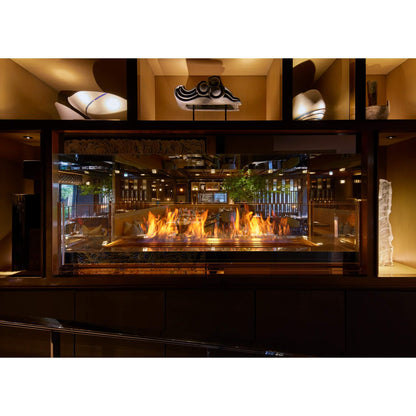 Fireplace with flames in a restaurant setting