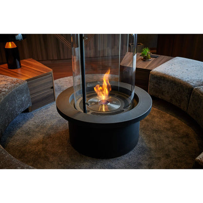Modern indoor fire pit with flames in a living room setting