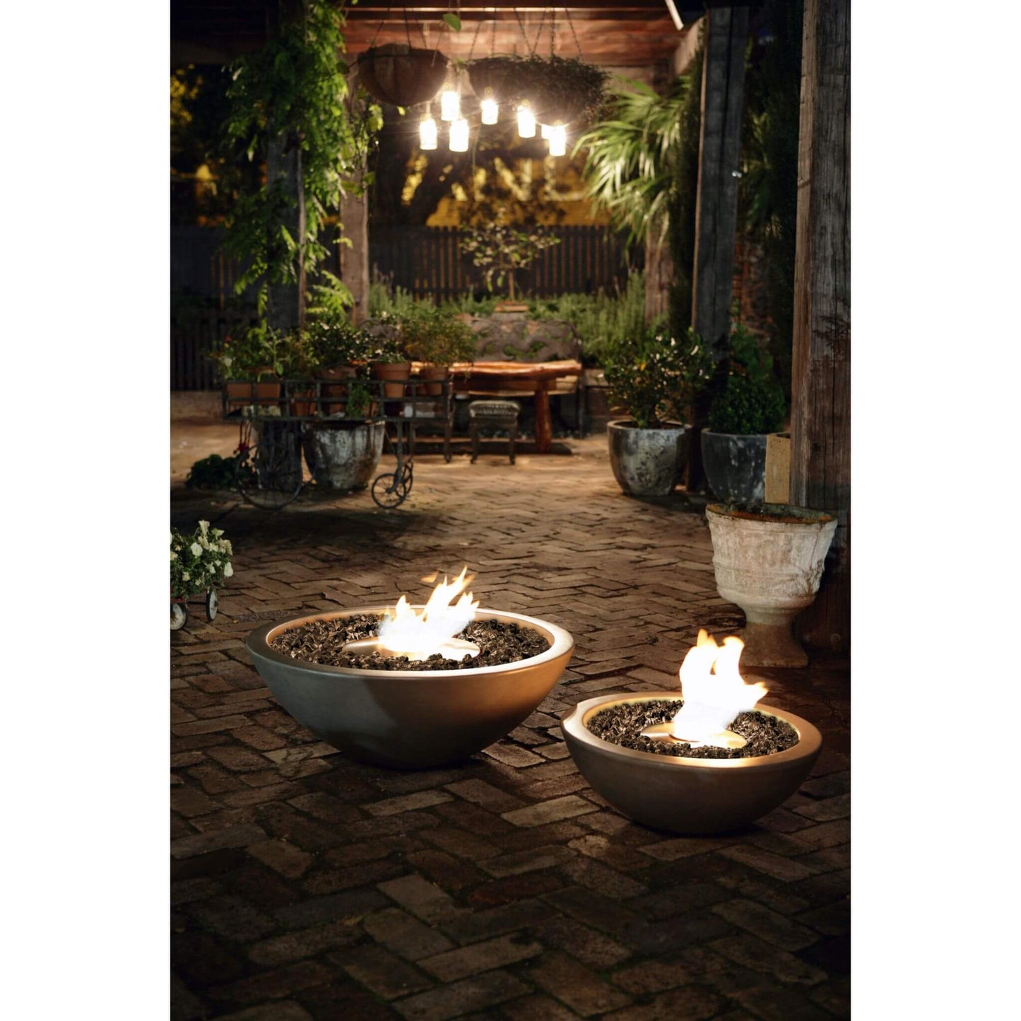 Ecosmart Fire Mix 850 and Mix 600 bioethanol fire pit bowl in grey concrete with a stainless steel burner positioned on outdoor garden patio area